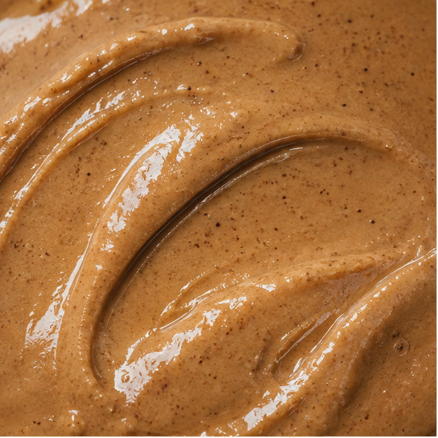 Organic smooth almond butter extreme close-up