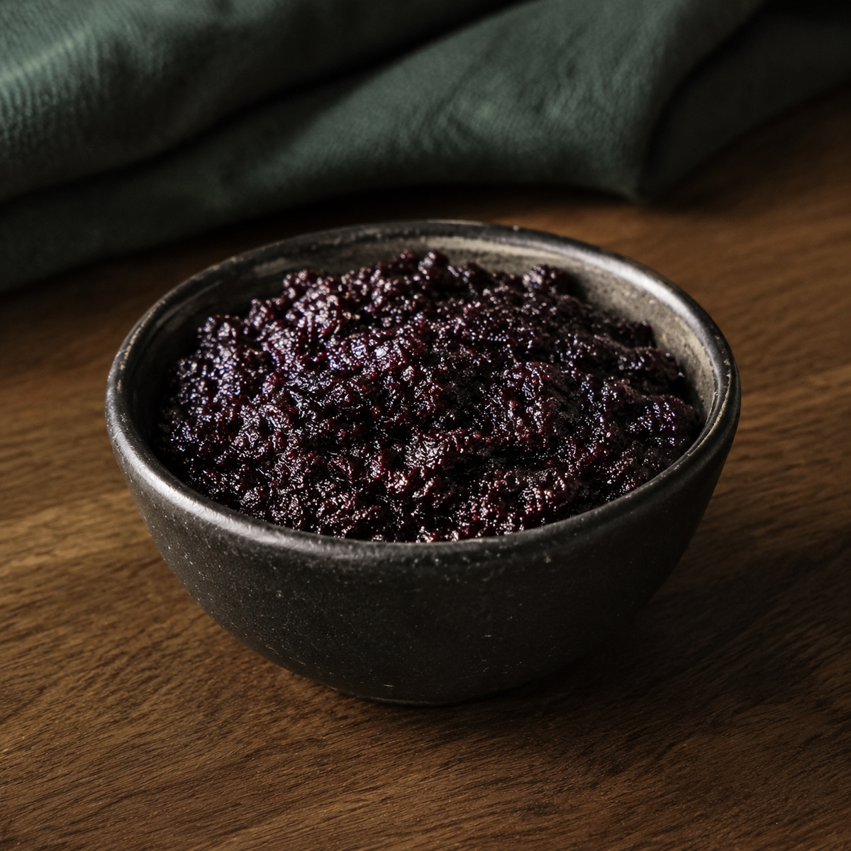 Bionova Organic Bilberry Jam in a dark ceramic bowl