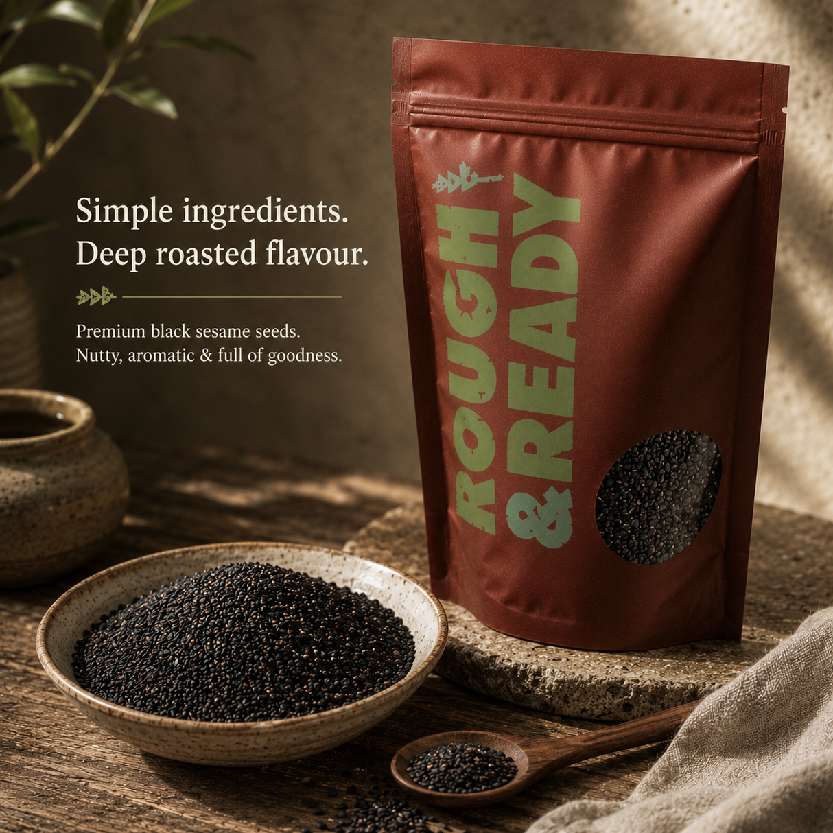 Rough & Ready black sesame seeds packaging with a bowl of seeds on a wooden surface.