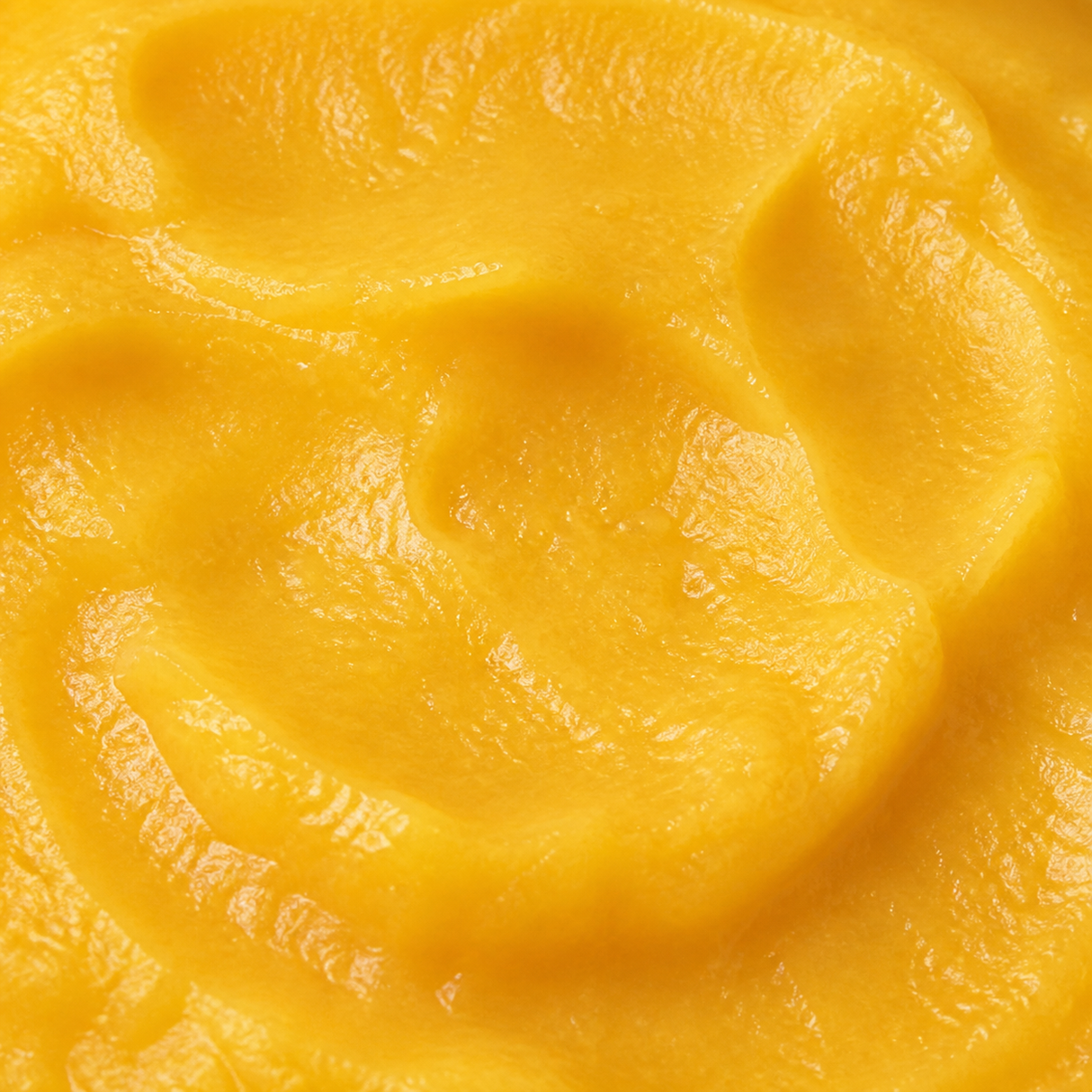 Extreme close-up of Clearspring organic apple and mango puree
