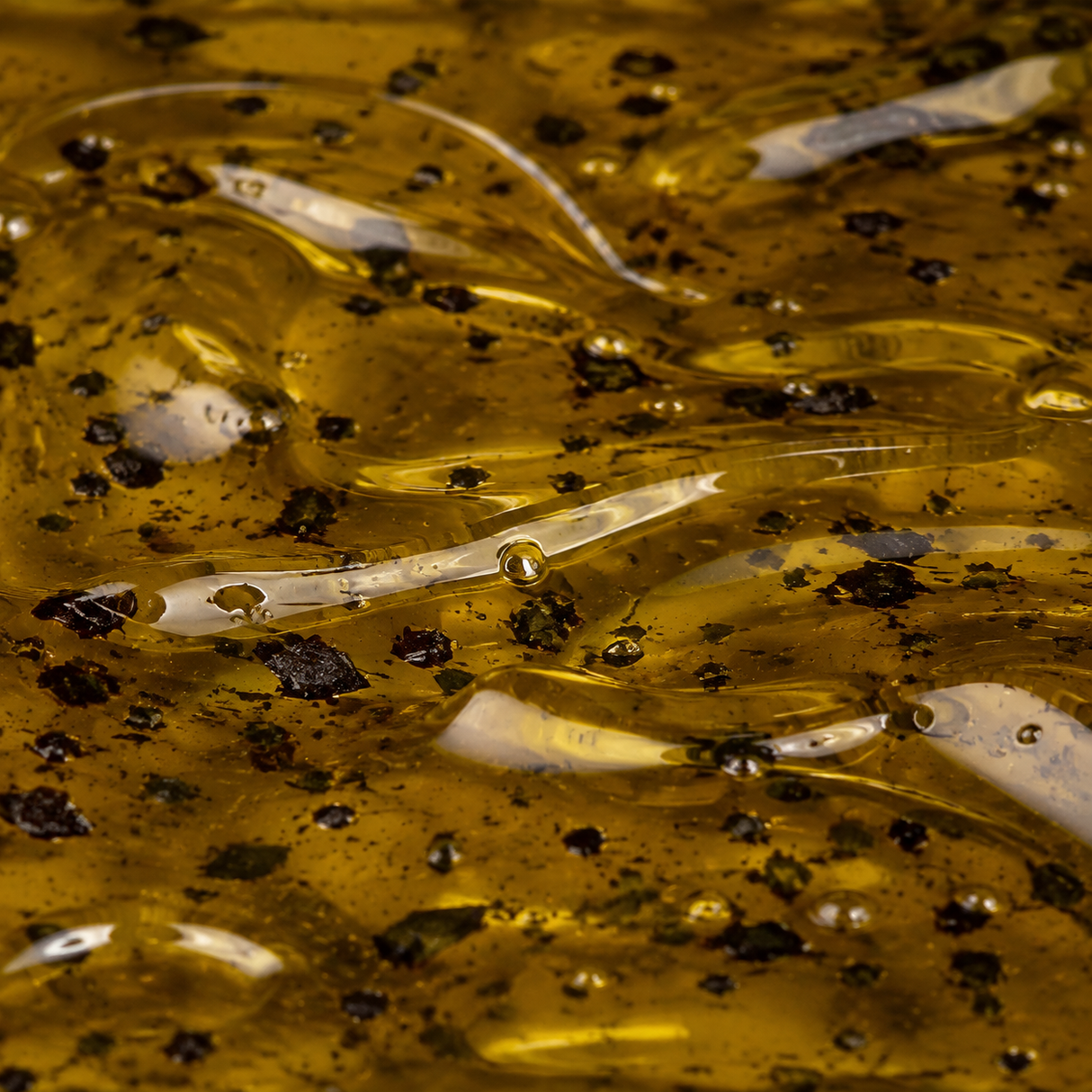 Extreme macro of black truffle infused olive oil