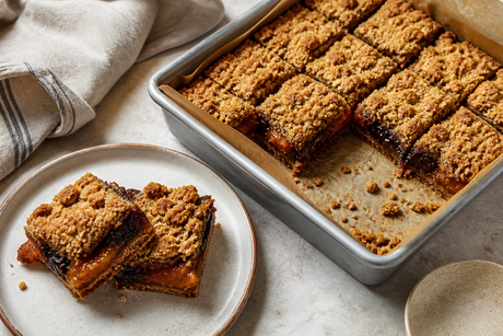 Apricot and prune rye crumble squares in a baking tin