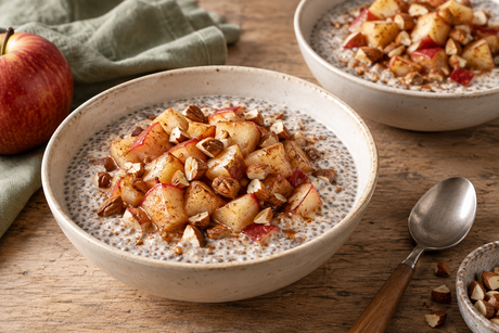 Warm chia breakfast bowls topped with cinnamon apple pieces and toasted chopped almonds