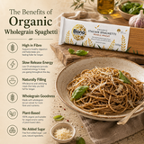 Biona organic wholegrain spaghetti package with a bowl of pasta on a wooden table.