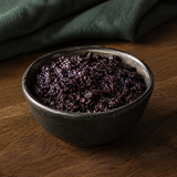 Bionova Organic Bilberry Jam in a dark ceramic bowl