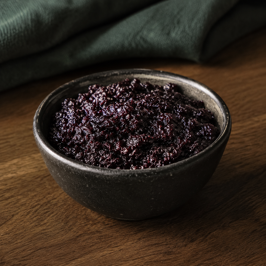 Bionova Organic Bilberry Jam in a dark ceramic bowl