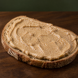 Carley's organic raw whole almond butter served on toast