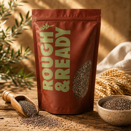 Bag of 'Rough & Ready' seeds with seeds in a wooden scoop and bowl on a wooden surface.