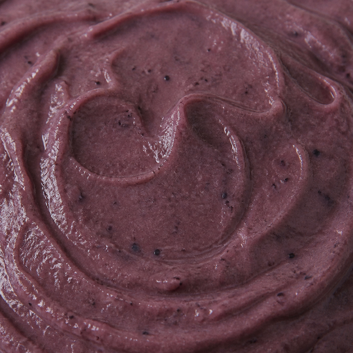 Extreme close-up of Clearspring organic apple and blueberry puree