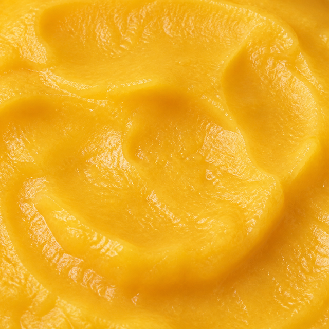 Extreme close-up of Clearspring organic apple and mango puree