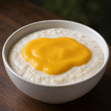Clearspring organic apple and mango puree served over porridge