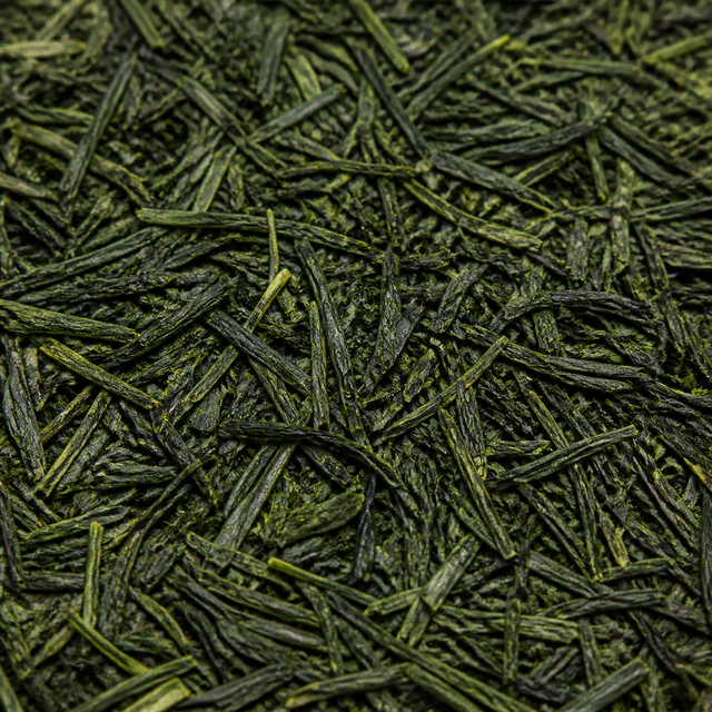 Extreme close-up of organic Sencha green tea leaves