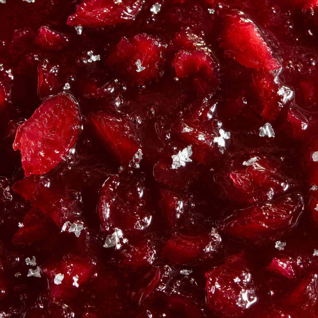 Cranberry and edible silver jelly extreme close-up