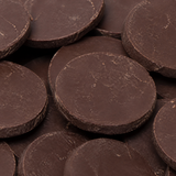 Extreme close-up of dark chocolate coins