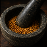 Organic fenugreek seeds in mortar and pestle