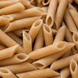 Extreme close-up of dry organic brown rice penne
