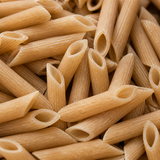 Extreme close-up of dry organic brown rice penne