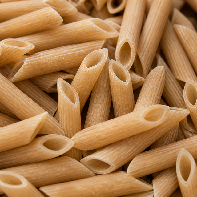 Extreme close-up of dry organic brown rice penne