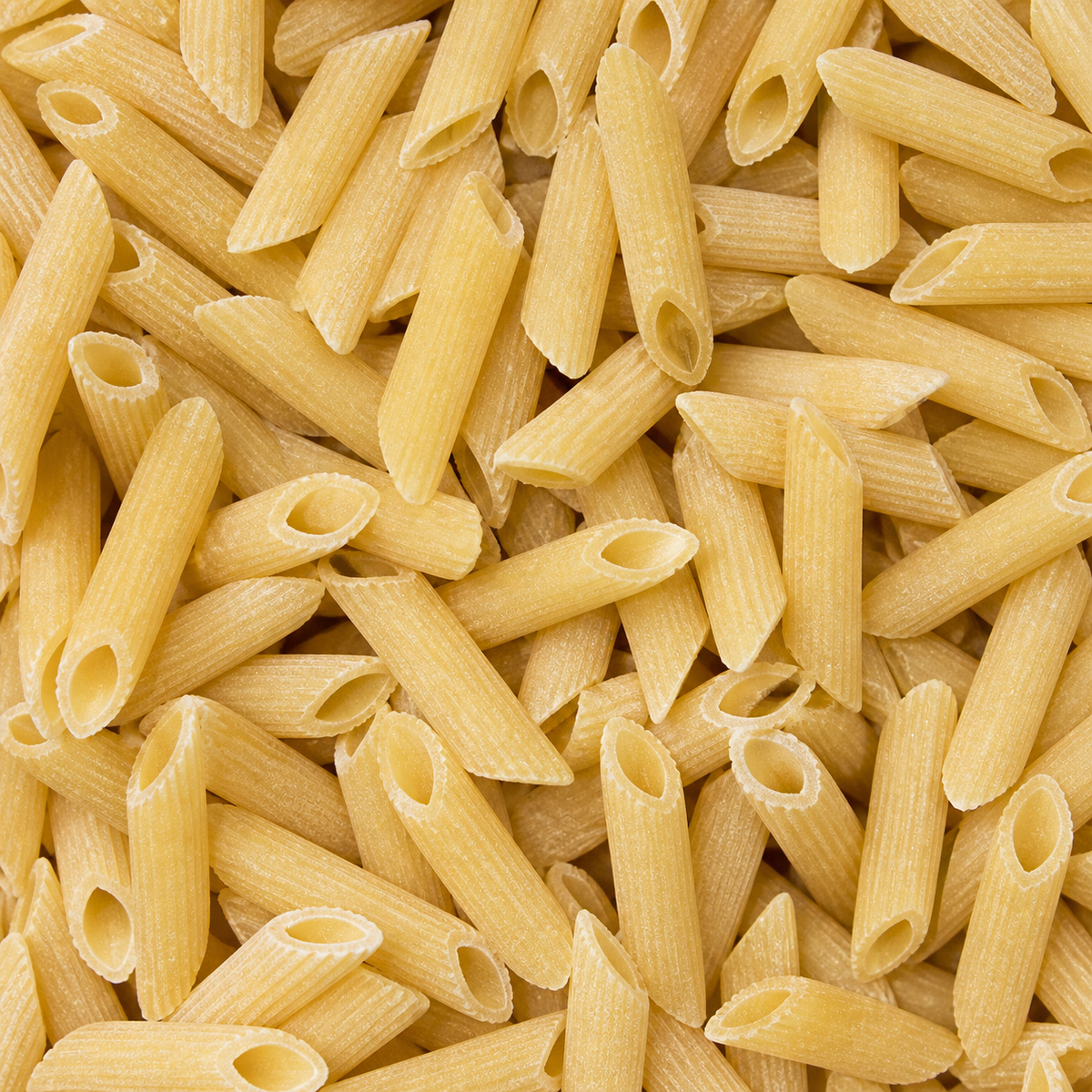 Extreme close-up of dry organic maize and rice penne