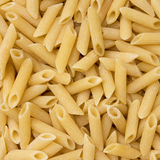 Extreme close-up of dry organic maize and rice penne