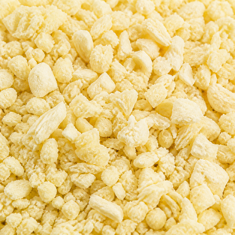 Extreme close-up of freeze-dried small pineapple nibs