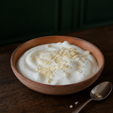 Yogurt topped with freeze-dried small pineapple nibs