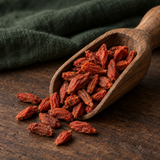 Dried goji berries in a walnut scoop
