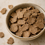 Close-up of Infinity Foods organic bran flakes in a cream bowl