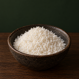 Infinity Organic Desiccated Coconut in a dark ceramic bowl