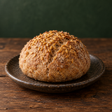 Wholemeal bread roll topped with organic golden linseed