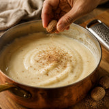 Freshly grated nutmeg over a creamy sauce