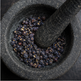 Juniper berries in mortar and pestle