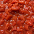 Close-up of chopped tomatoes in tomato juice