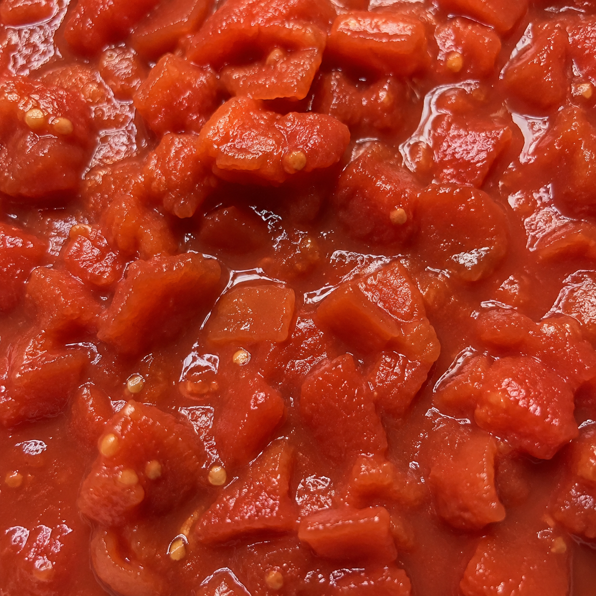 Close-up of chopped tomatoes in tomato juice