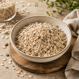 Bowl of oats on a wooden surface with a neutral background