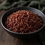 Cooked organic Camargue red rice served in a dark ceramic bowl