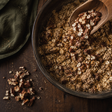 Organic pecan pieces added to a rustic oat bake