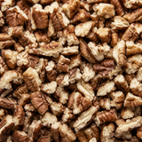 Extreme close-up of organic pecan pieces