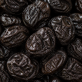Extreme close-up of organic pitted prunes