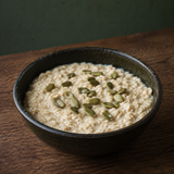 Organic pumpkin seeds served on porridge