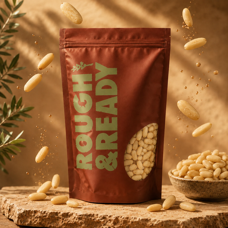 Brown package labeled 'Rough & Ready' with scattered beans on a wooden surface.