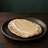 Light tahini spread on pitta bread