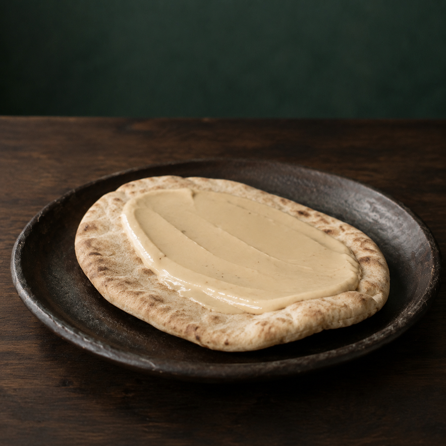 Light tahini spread on pitta bread